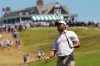 Scottie Scheffler watches his shot on the first hole during the third round of the U.S. Open golf tournament at Shinnecock Hills Golf Club in Southampton, N.Y., Saturday, June 20, 2026.(AP Photo/David J. Phillip)