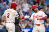 Philadelphia Phillies' Kyle Schwarber, front right, celebrates after his home run with Bryce Harper (3) during the third inning of a baseball game against the New York Mets, Saturday, June 20, 2026, in Philadelphia. (AP Photo/Chris Szagola)