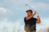 Xander Schauffele watches his tee shot on the 17th hole during the third round of the U.S. Open golf tournament at Shinnecock Hills Golf Club in Southampton, N.Y., Saturday, June 20, 2026.(AP Photo/David J. Phillip)