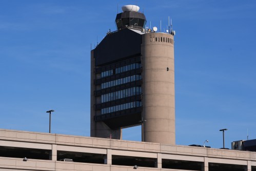 FILE - The control tower at Logan Airport, on Dec. 9, 2025, in Boston. (AP Photo/Charles Krupa, File)