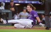 Colorado Rockies' Jake McCarthy slides safely across home plate to notch an inside-the-park home run off Pittsburgh Pirates starting pitcher Paul Skenes in the first inning of a baseball game Saturday, June 20, 2026, in Denver. (AP Photo/David Zalubowski)