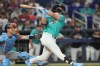 Miami Marlins' Kyle Stowers, right, hits a home run during the second inning of a baseball game against the San Francisco Giants, Sunday, June 21, 2026, in Miami. (AP Photo/Jim Rassol)