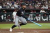 Minnesota Twins' Alex Jackson watches his RBI single against the Arizona Diamondbacks in the seventh inning of a baseball game, Sunday, June 21, 2026, in Phoenix. (AP Photo/Rick Scuteri)