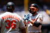 Baltimore Orioles' Colton Cowser, right, reacts after hitting an RBI single during the first inning of a baseball game against the Los Angeles Dodgers, Sunday, June 21, 2026, in Los Angeles. (AP Photo/Caroline Brehman)