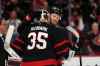 Ottawa Senators' Brady Tkachuk (7) embraces goaltender Linus Ullmark (35) after their team was eliminated by the Carolina Hurricanes at the end of the third period of first-round Game 4 NHL playoff hockey action in Ottawa, on Saturday, April 25, 2026. THE CANADIAN PRESS/Justin Tang