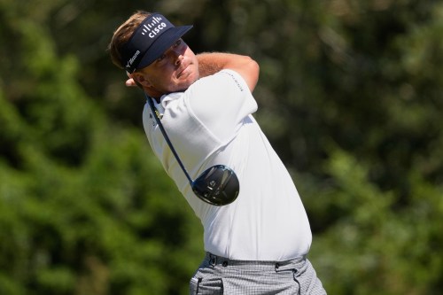 Keith Mitchell watches his tee shot on the sixth hole during the final round of the U.S. Open golf tournament at Shinnecock Hills Golf Club in Southampton, N.Y., Sunday, June 21, 2026. (AP Photo/David J. Phillip)