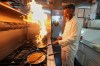 Chef Mohammed Shanoor Ali cooks at a Bangladeshi restaurant in London, Thursday, June 18, 2026. (AP Photo/Kin Cheung)