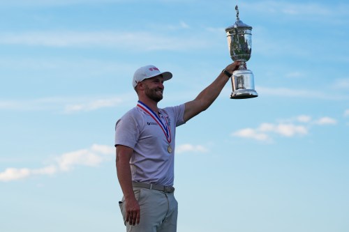 Wyndham Clark holds the trophy after winning the U.S. Open golf tournament at Shinnecock Hills Golf Club in Southampton, N.Y., Sunday, June 21, 2026. (AP Photo/Seth Wenig)