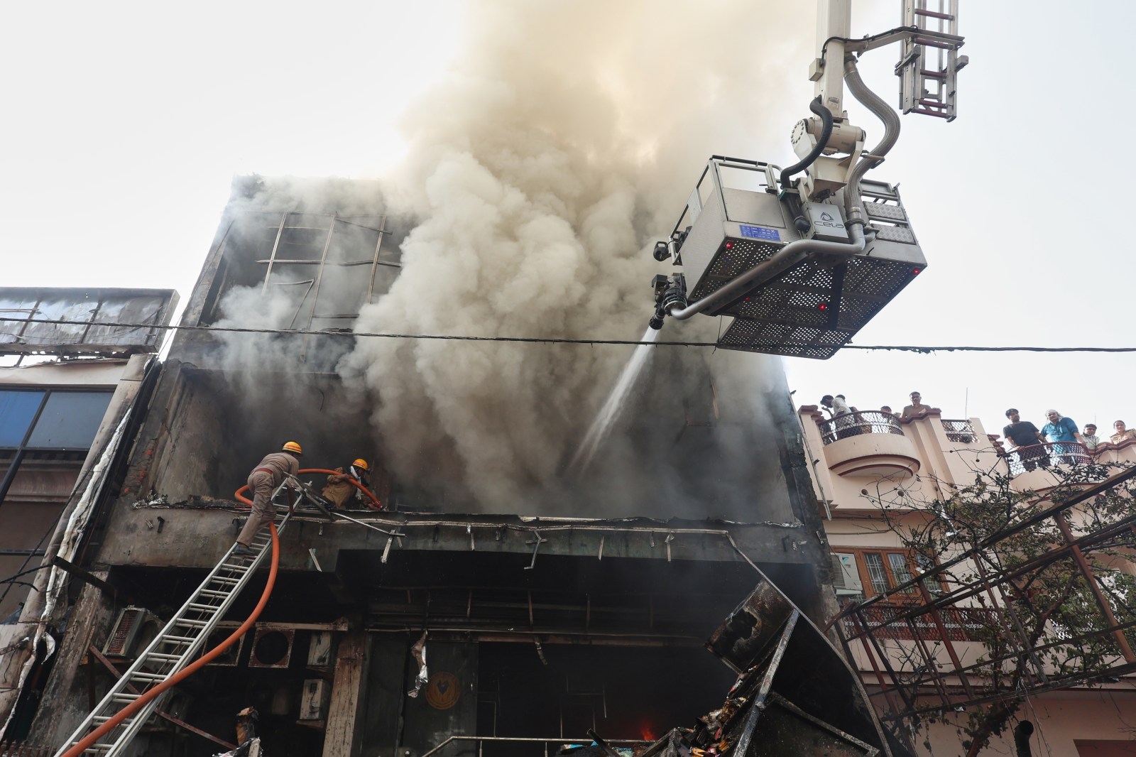Fire tears through building in northern India, killing 14, mostly students