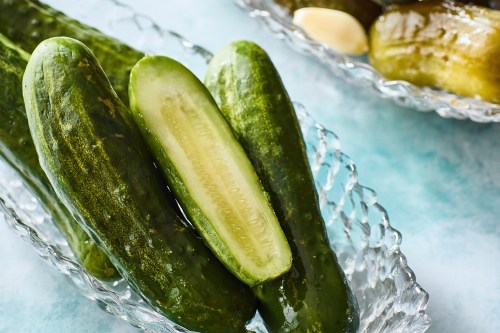 This image released by Voracious shows a recipe for half sour pickles from the cookbook 