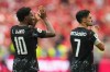 Canada's Jonathan David, left, and Stephen Eustaquio celebrate their team's win in the World Cup Group B soccer match against Qatar in Vancouver, British Columbia, Thursday, June 18, 2026. (AP Photo/Abbie Parr)