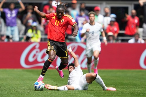 Belgium's Jeremy Doku, top, and Egypt's Marawan Attia battle for the ball during the World Cup Group G soccer match in Seattle, Monday, June 15, 2026. (AP Photo/Lindsey Wasson)