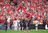 Canada's Nathan Saliba (25) celebrates his goal against Qatar with Cyle Larin (9) and Ali Ahmed (20) during the second half of a World Cup Group B soccer match, in Vancouver, on Thursday, June 18, 2026. THE CANADIAN PRESS/Darryl Dyck