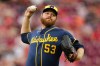 Milwaukee Brewers pitcher Brandon Woodruff throws during the first inning of a baseball against the Cincinnati Reds in Cincinnati, Monday, June 22, 2026. (AP Photo/Carolyn Kaster)