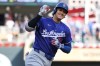 Los Angeles Dodgers designated hitter Shohei Ohtani celebrates as he runs the bases on his solo home run against the Minnesota Twins during the first inning of a baseball game, Monday, June 22, 2026, in Minneapolis. (AP Photo/Matt Krohn)