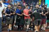 A bagpipe band marches in the outfield as Scotland soccer fans with the Tartan Army attend a baseball game between the Miami Marlins and the Texas Rangers, Monday, June 22, 2026, in Miami. (AP Photo/Lynne Sladky)
