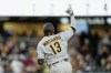 San Diego Padres' Manny Machado celebrates after hitting a home run during the fourth inning of a baseball game against the Atlanta Braves Monday, June 22, 2026, in San Diego. (AP Photo/Gregory Bull)