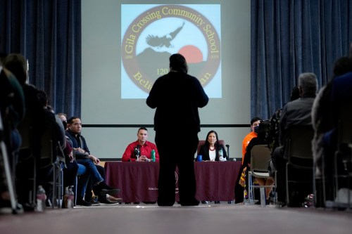 FILE - U.S. Interior Secretary Deb Haaland, right, and Assistant Secretary for Indian Affairs Bryan Newland, left, listen as April Hiosik Ignacio, center, speaks, Jan. 20, 2023, in Laveen, Ariz. (AP Photo/Matt York, File)