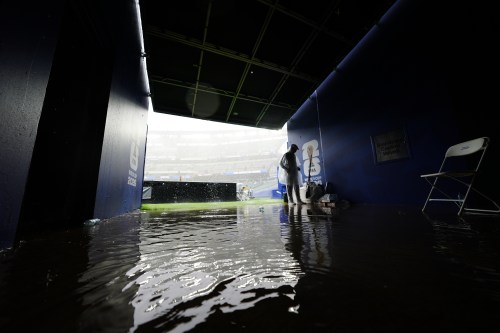 Water floods a tunnel that leads to the field during a weather delay in the World Cup Group I soccer match between France and Iraq in Philadelphia, Monday, June 22, 2026. (AP Photo/Derik Hamilton)