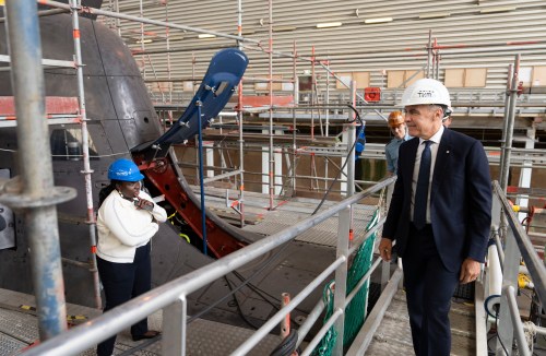 Prime Minister Mark Carney looks over a 212A class submarine under maintenance as he tours Thyssenkrupp Marine Systems (TKMS), a submarine building facility in Kiel, Germany, on Tuesday, Aug. 26, 2025. THE CANADIAN PRESS/Christinne Muschi