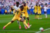 Ghana's Fatawu Issahaku (7) and England's Noni Madueke (20) battle for the ball during the World Cup Group L soccer match between England and Ghana in Foxborough, Mass., near Boston, Tuesday, June 23, 2026. (AP Photo/Petr David Josek)