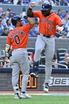 Houston Astros' Taylor Trammell (26) celebrates with Brice Matthews (0) after hitting a solo home run against the Toronto Blue Jays during fourth inning MLB baseball action in Toronto on Tuesday June 23, 2026. THE CANADIAN PRESS/Jon Blacker