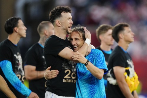 Croatia's Luka Modric (right) celebrates with Ivan Perisic after defeating Panama as teammates wear shirts honouring his 200th appearance for Croatia following a World Cup Group L soccer match in Toronto on June 23, 2026. THE CANADIAN PRESS/Nathan Denette