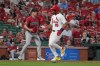 St. Louis Cardinals' José Fermín (15) scores past Arizona Diamondbacks pitcher Paul Sewald during the ninth inning of a baseball game Tuesday, June 23, 2026, in St. Louis. (AP Photo/Jeff Roberson)