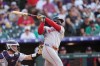 Boston Red Sox's Wilyer Abreu follows the flight of his RBI triple off Colorado Rockies starting pitcher Sean Sullivan in the first inning of a baseball game Tuesday, June 23, 2026, in Denver. (AP Photo/David Zalubowski)