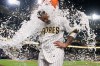 San Diego Padres' Manny Machado is doused after hitting a walk off single to defeat the Atlanta Braves during the tenth inning of a baseball game Tuesday, June 23, 2026, in San Diego. (AP Photo/Gregory Bull)