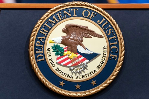 FILE - The Department of Justice seal is seen during a news conference at the DOJ office in Washington, May 16, 2023. (AP Photo/Jose Luis Magana, File)