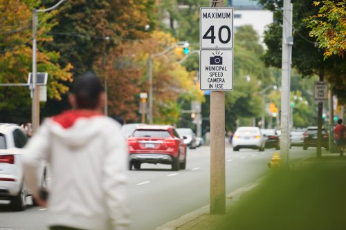 Vehicles pass a sign advising drivers of an upcoming speed camera in Toronto, on Wednesday, Sept. 24, 2025. THE CANADIAN PRESS/Sammy Kogan