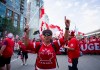 Canada fans march to B.C. Place stadium before Canada and Switzerland play a World Cup Group B soccer match, in Vancouver, on Wednesday, June 24, 2026. THE CANADIAN PRESS/Jacob Mallari