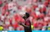 Canada's Alphonso Davies (19) pauses as he walks on to the field for warm up prior to the first half of a World Cup Group B soccer match against Switzerland, in Vancouver, on Wednesday, June 24, 2026. THE CANADIAN PRESS/Darryl Dyck