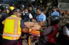 Rescue worker carry an injured man after an earthquake in Caracas, Venezuela, Wednesday, June 24, 2026. (AP Photo/Ariana Cubillos)