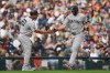 New York Yankees' Paul Goldschmidt is congratulated by third base coach Luis Rojas after hitting a home run against the Detroit Tigers during the third inning of a baseball game Wednesday, June 24, 2026, in Detroit. (AP Photo/Paul Sancya)