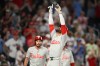 Philadelphia Phillies' Derek Hill celebrates his two-run home run with during the ninth inning of a baseball game against the Washington Nationals, Wednesday, June 24, 2026, in Washington. (AP Photo/Nick Wass)