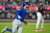 Chicago Cubs' Dansby Swanson runs to first base for a two-run single during the ninth inning in the second baseball game of a doubleheader against the Chicago Cubs Wednesday, June 24, 2026, in New York. (AP Photo/Frank Franklin II)