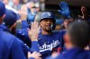 Los Angeles Dodgers' Mookie Betts celebrates his 300th career home run against the Minnesota Twins during the second inning of a baseball game, Wednesday, June 24, 2026, in Minneapolis. (AP Photo/Matt Krohn)