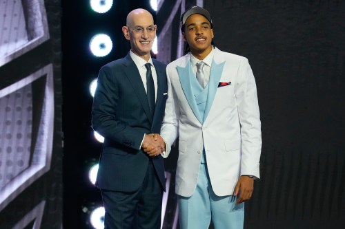 Mikel Brown Jr., right, poses for a photo with NBA Commissioner Adam Silver, left, after being selected by the Brooklyn Nets with the No. 6 overall pick in the NBA Draftin the first round of the NBA basketball draft, Tuesday, June 23, 2026, in New York. (AP Photo/Yuki Iwamura)