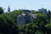 The Peace Tower stands in the distance behind 24 Sussex in Ottawa on Wednesday, June 24, 2026. THE CANADIAN PRESS/Adrian Wyld