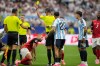 Referee Amin Mohamed Omar shows a yellow card to Austria's Konrad Laimer, below, during the World Cup Group J soccer match in Arlington, Texas, near Dallas, Monday, June 22, 2026. (AP Photo/Tony Gutierrez)
