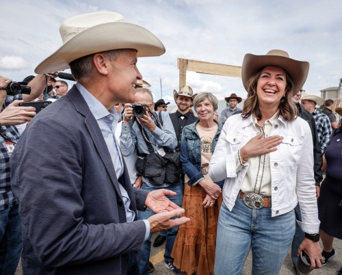 Prime Minister Mark Carney is coming to next week’s Calgary Stampede. Carney, left, meets with Alberta Premier Danielle Smith as the pair attend a Stampede breakfast in Calgary, Alta., Saturday, July 5, 2025. THE CANADIAN PRESS/Jeff McIntosh