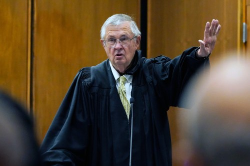 FILE - Senior Judge Glen H. Davidson speaks to the audience during the 