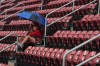 Fans wait out a rain delay postponing the start of a baseball game between St. Louis Cardinals and Arizona Diamondbacks Thursday, June 25, 2026, in St. Louis. (AP Photo/Jeff Roberson)