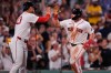 Boston Red Sox's Caleb Durbin, right, is congratulated by Willson Contreras after his two-run home run off New York Yankees' Cam Schlittler in the fifth inning of a baseball game, Thursday, June 25, 2026, in Boston. (AP Photo/Charles Krupa)
