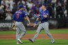 Chicago Cubs' Alex Bregman (3) and Pete Crow-Armstrong, right, celebrate after a win in the 10th inning of a baseball game against the New York Mets, Thursday, June 25, 2026, in New York. (AP Photo/Heather Khalifa)