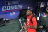 James Clark, a shortstop from St. John Bosco High School, gathers his gear in the dugout at the MLB baseball combine in Phoenix, Tuesday, June 23, 2026. (AP Photo/Ross D. Franklin)