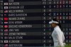 Ina Yoon, of South Korea, walks by a scoreboard on the ninth hole during the second round of the Women's PGA Championship golf tournament, Friday, June 26, 2026, in Chaska, Minn. (AP Photo/Matt York)
