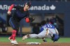 Texas Rangers shortstop Ezequiel Duran (20) slides safely into second base with a steal, ahead of a tag by Toronto Blue Jays infielder Ernie Clement (22) during sixth inning MLB baseball action in Toronto on Friday, June 26, 2026. THE CANADIAN PRESS/Jon Blacker